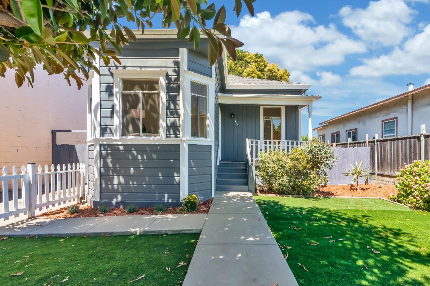 front view of a house with a yard