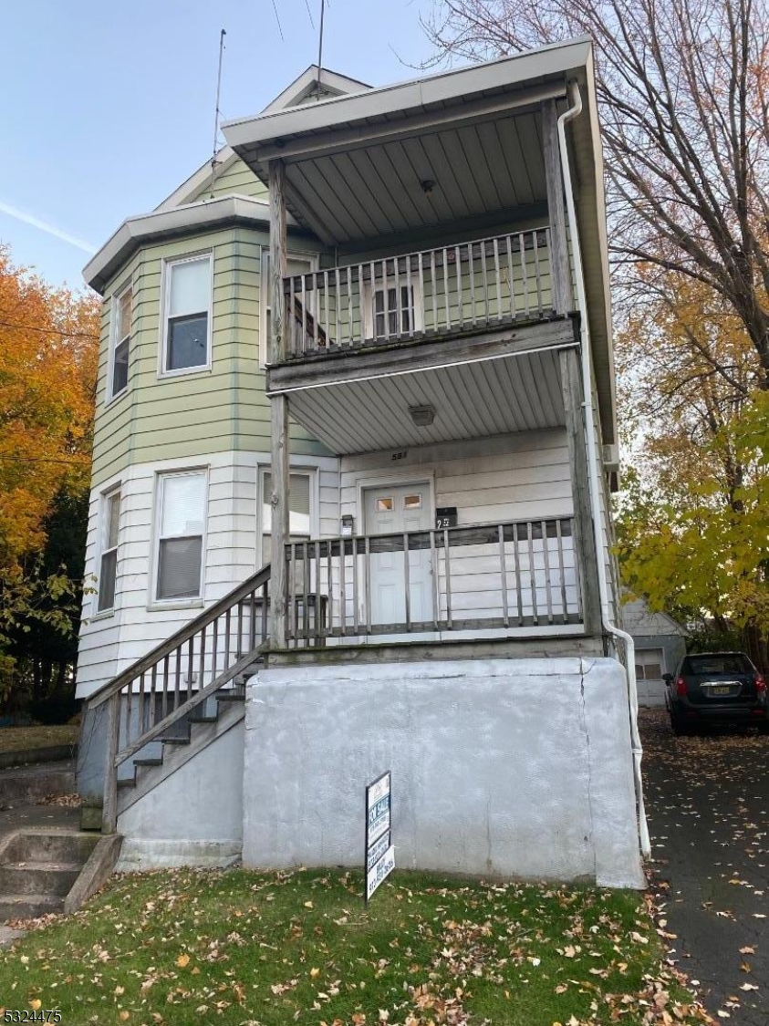 a front view of a house with balcony