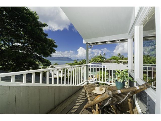 a view of a balcony with wooden floor