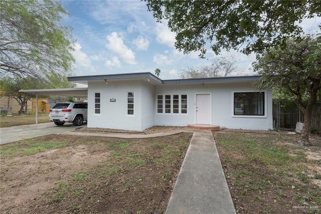 View of front facade with a carport