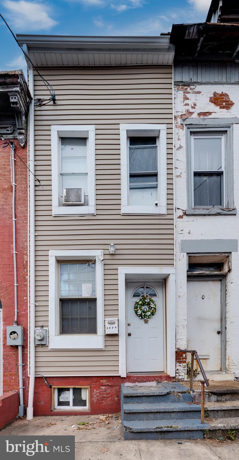 a front view of a house with a balcony