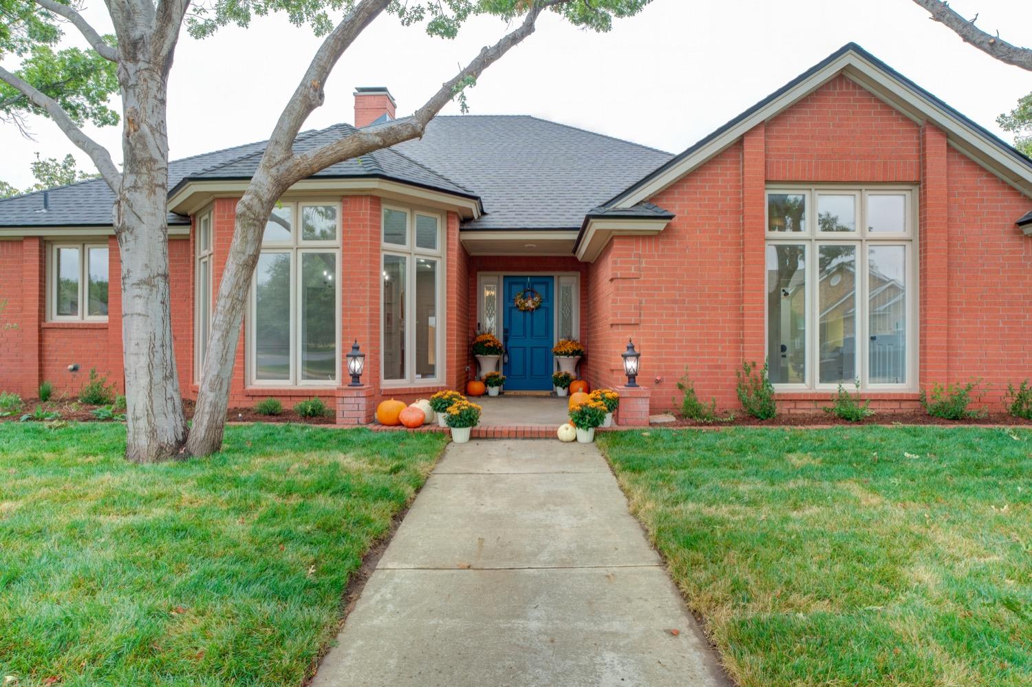 front view of a house with a yard