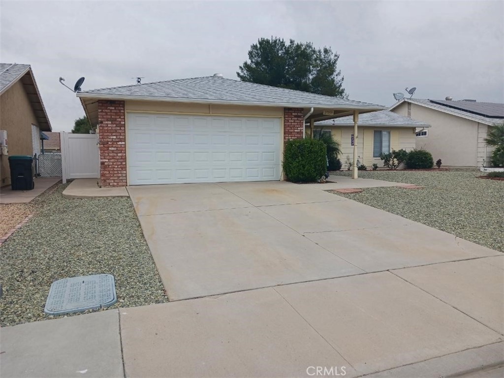 a front view of a house with garage