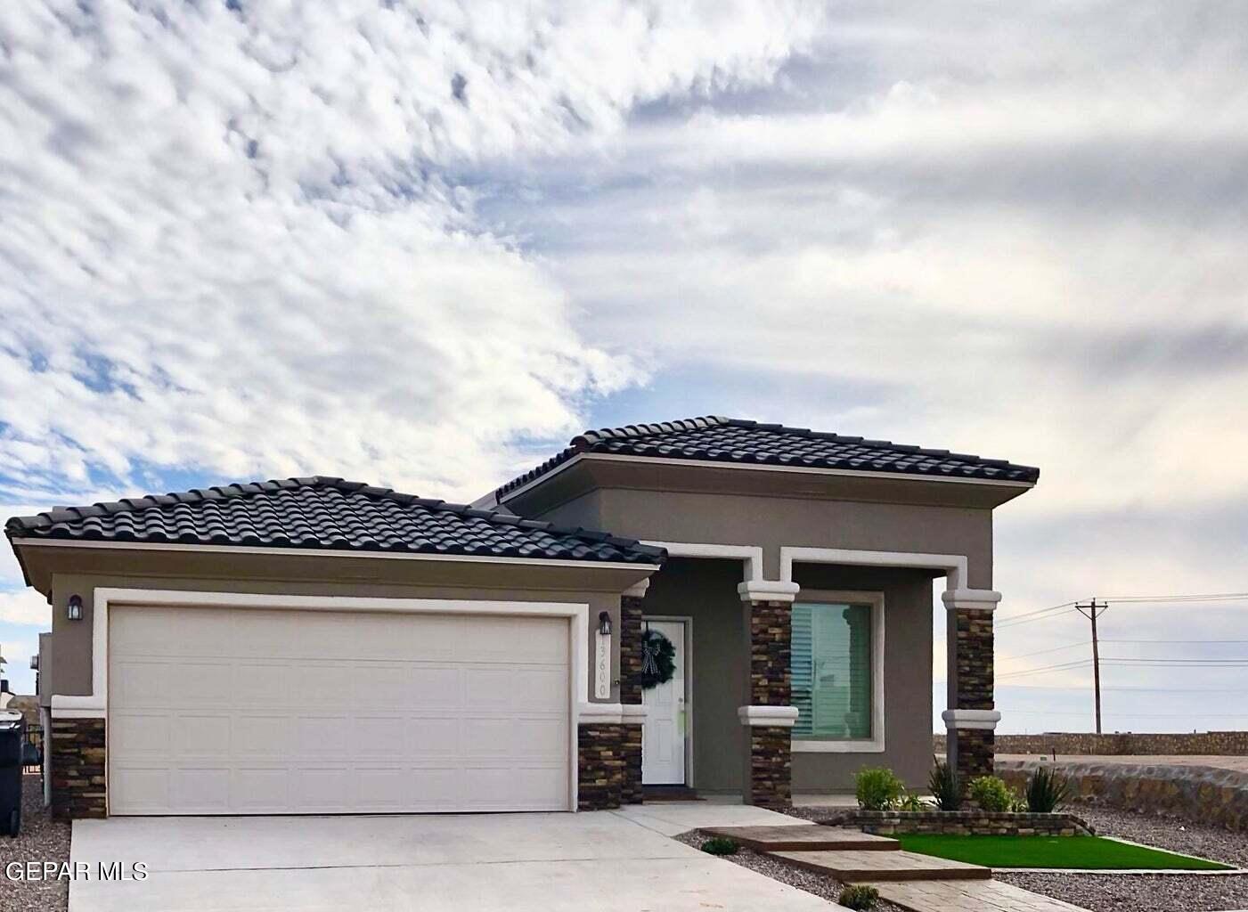 front view of a house with a barbeque