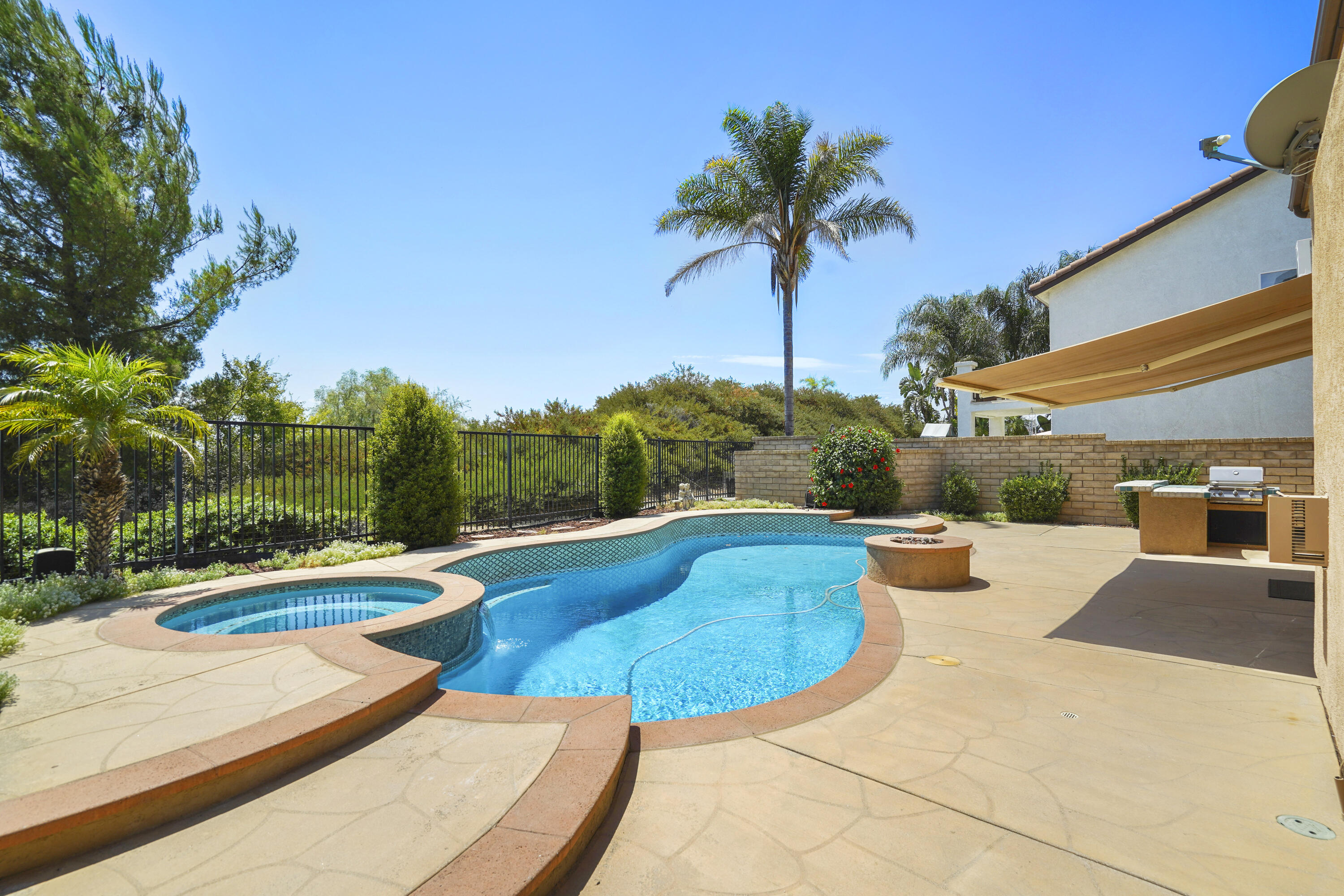 a view of a swimming pool with a patio