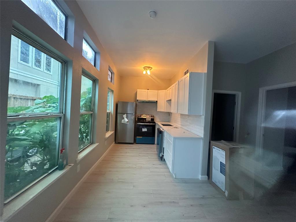 a view of a living room with a large window