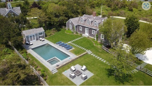 an aerial view of a house with a garden