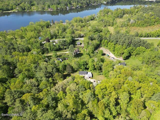 an aerial view of a houses with yard