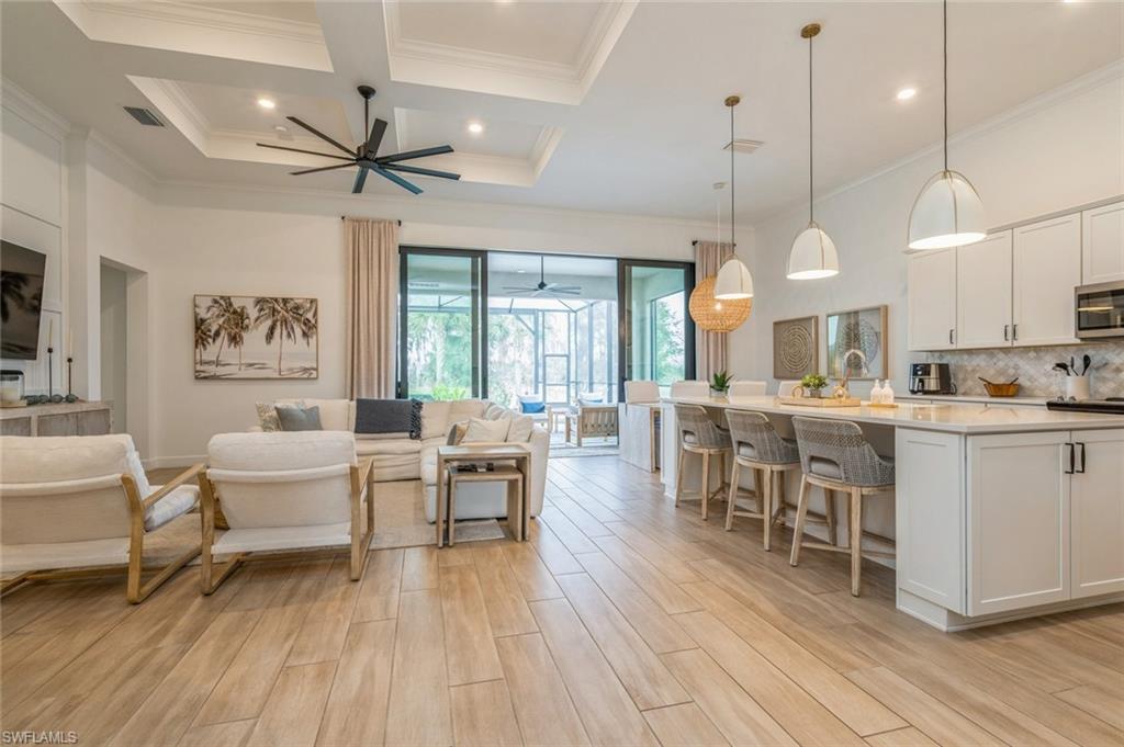 a large kitchen with a table and chairs