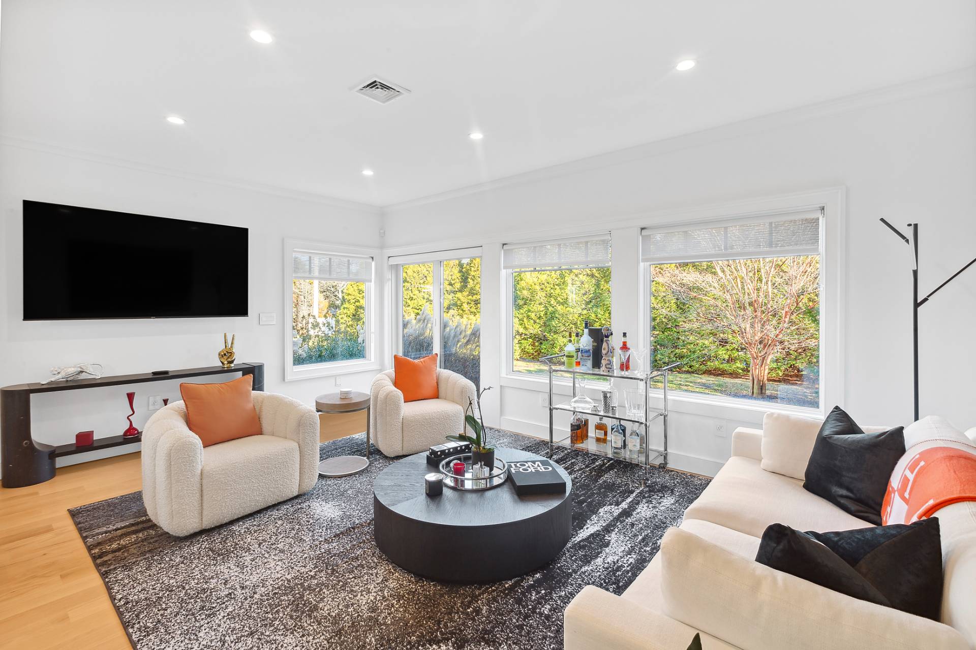 a living room with furniture and a flat screen tv