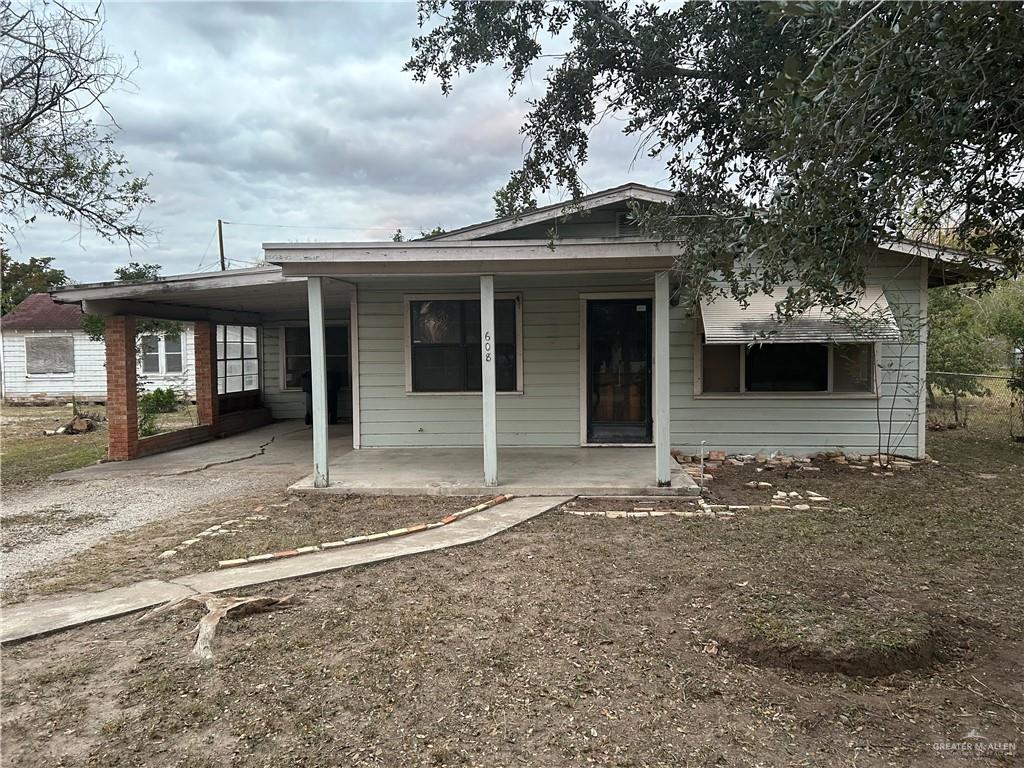 View of front of property featuring a carport