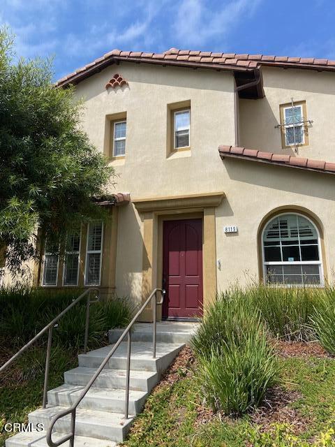 a front view of a house with yard