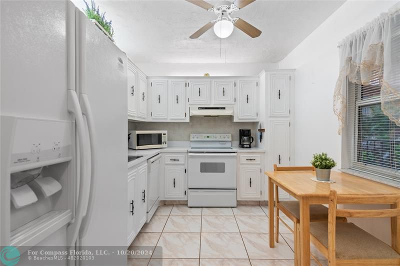 a kitchen with stainless steel appliances a stove a sink and a refrigerator