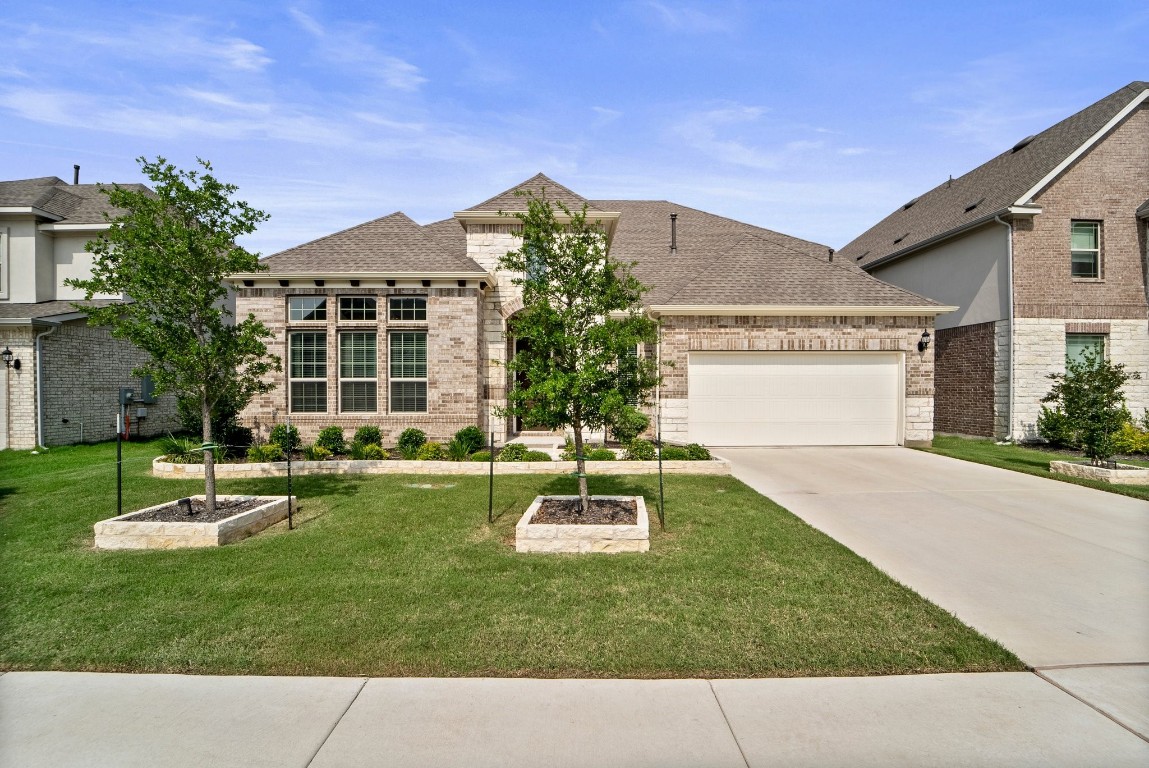 a front view of a house with a yard