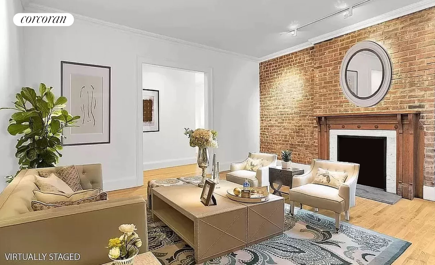 a living room with furniture a clock and a fireplace