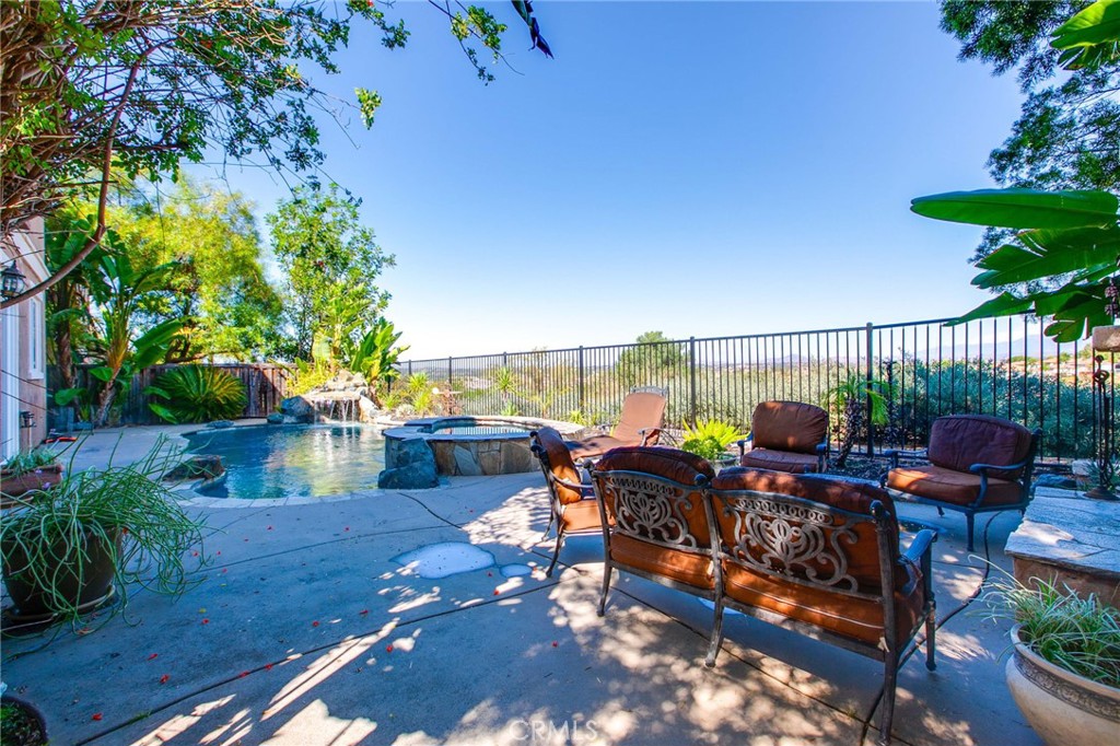 a view of a chairs and tables in the patio