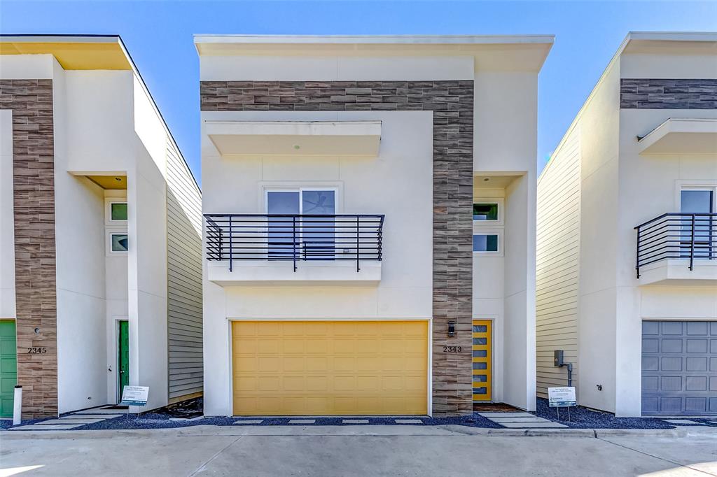 a front view of a house with a garage