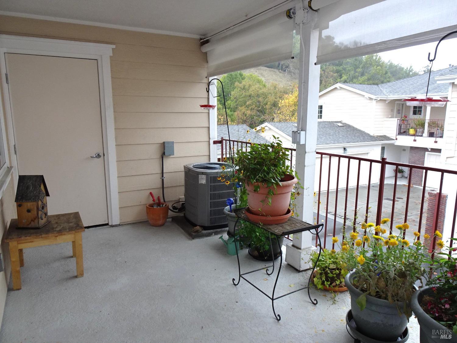 a room with furniture and a potted plant