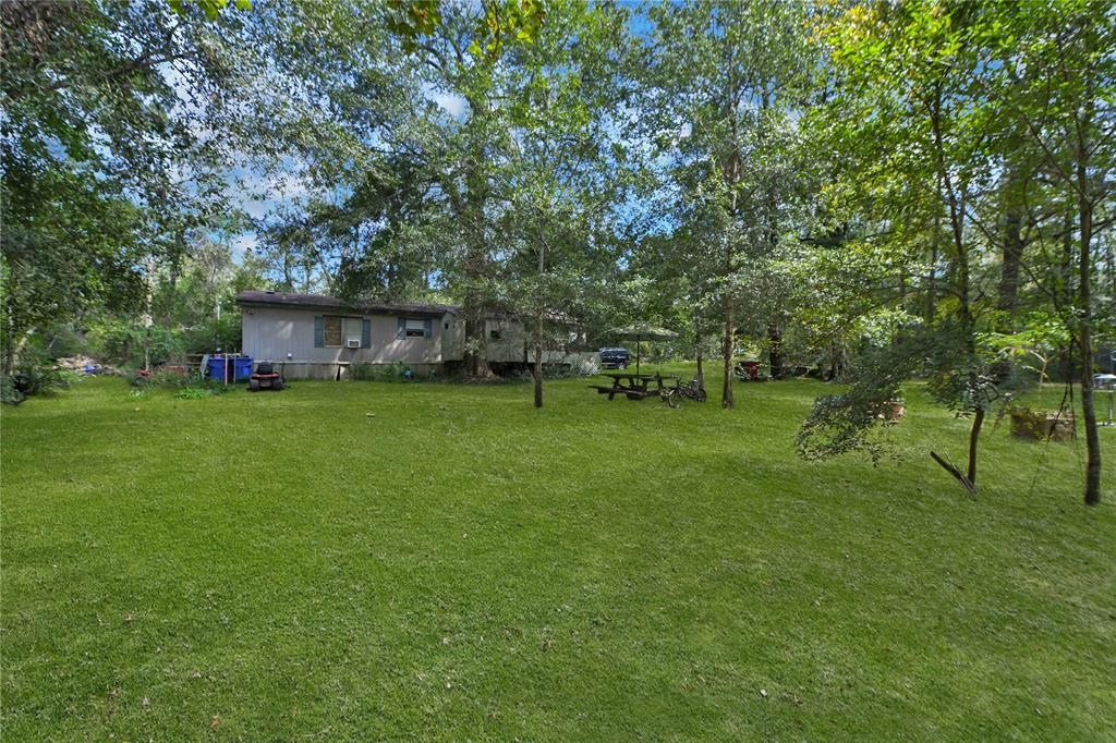 a view of a house with a big yard