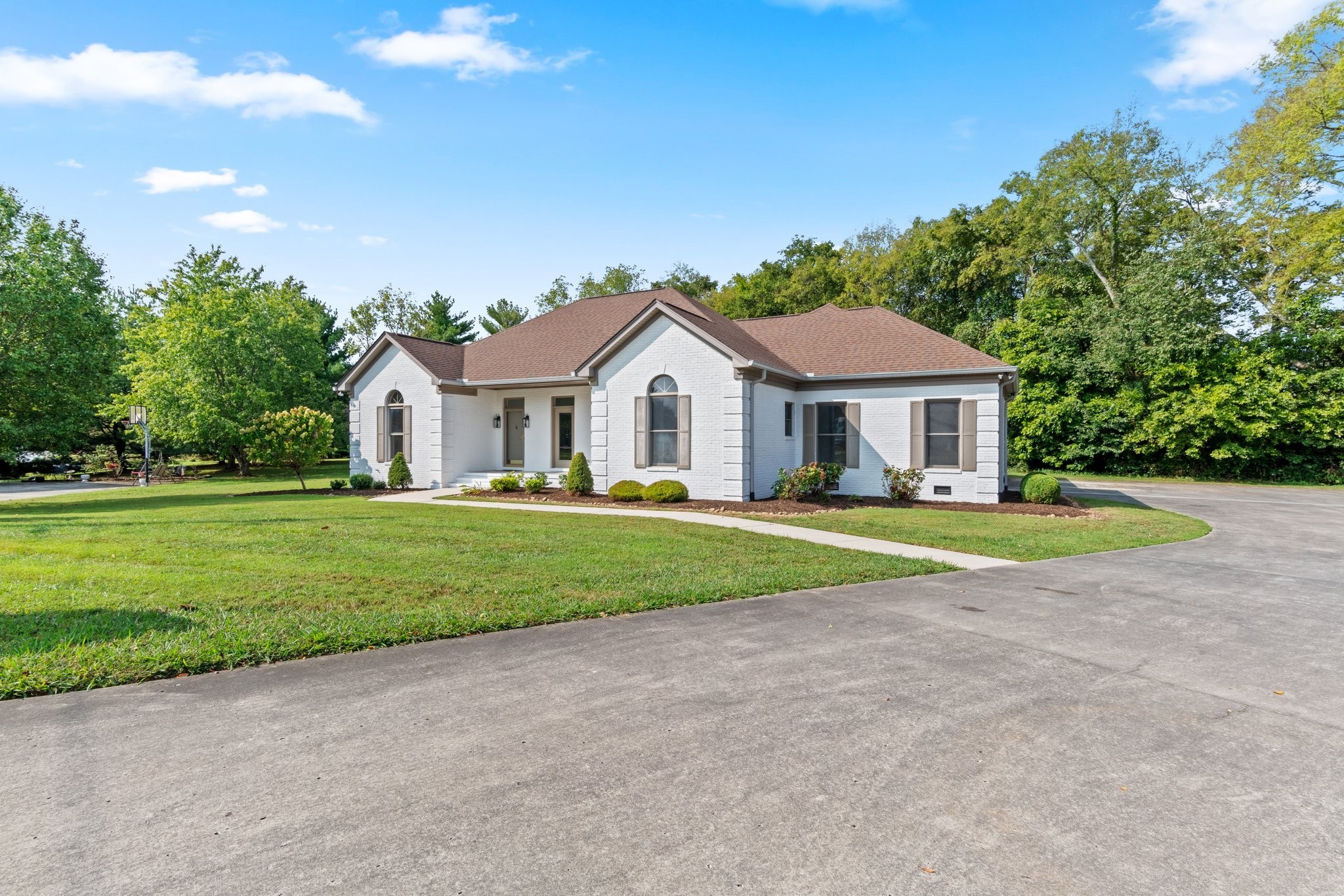 a front view of a house with a yard