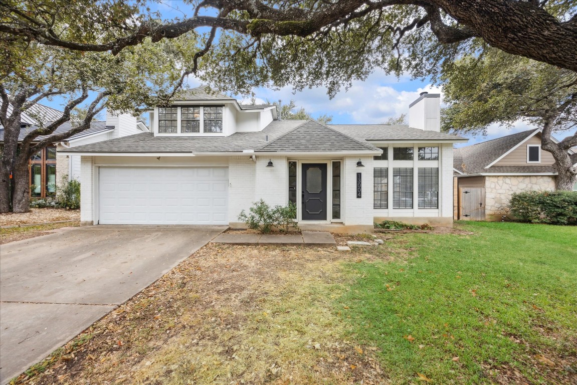 front view of a house with a garden