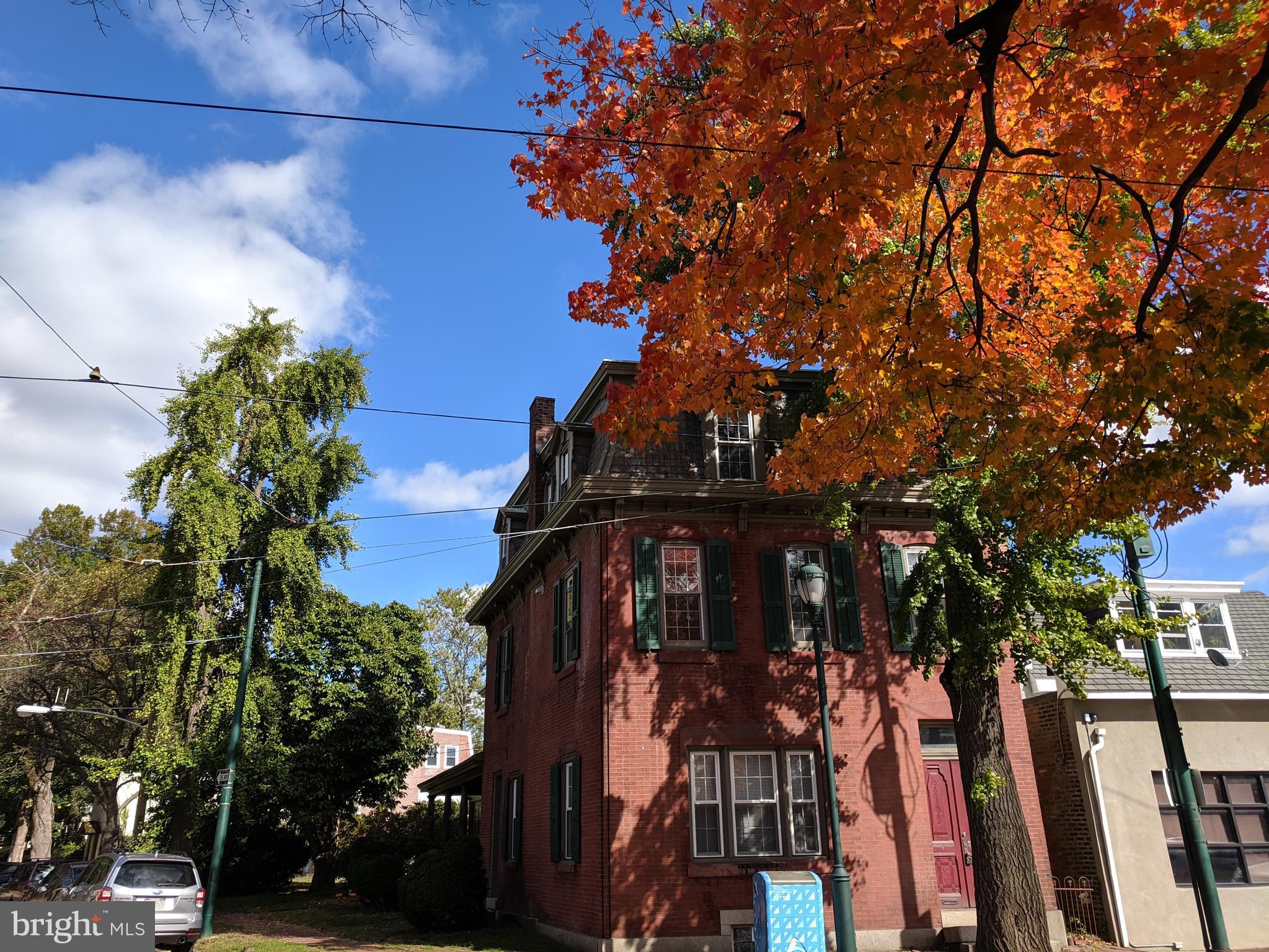 a view of a house with a tree