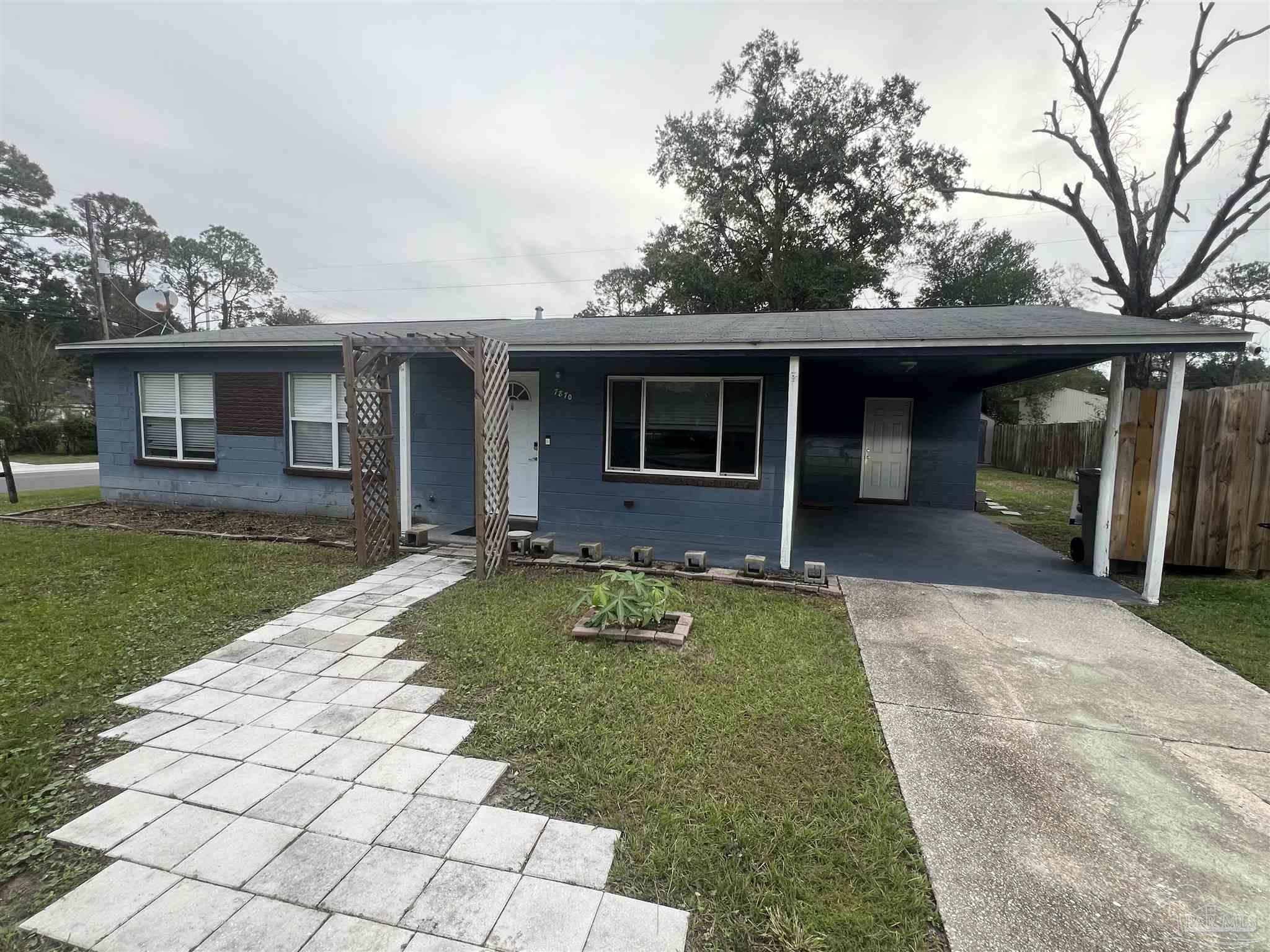 front view of a house with a yard