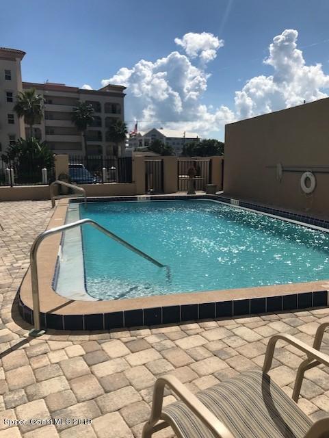 a view of swimming pool with seating space