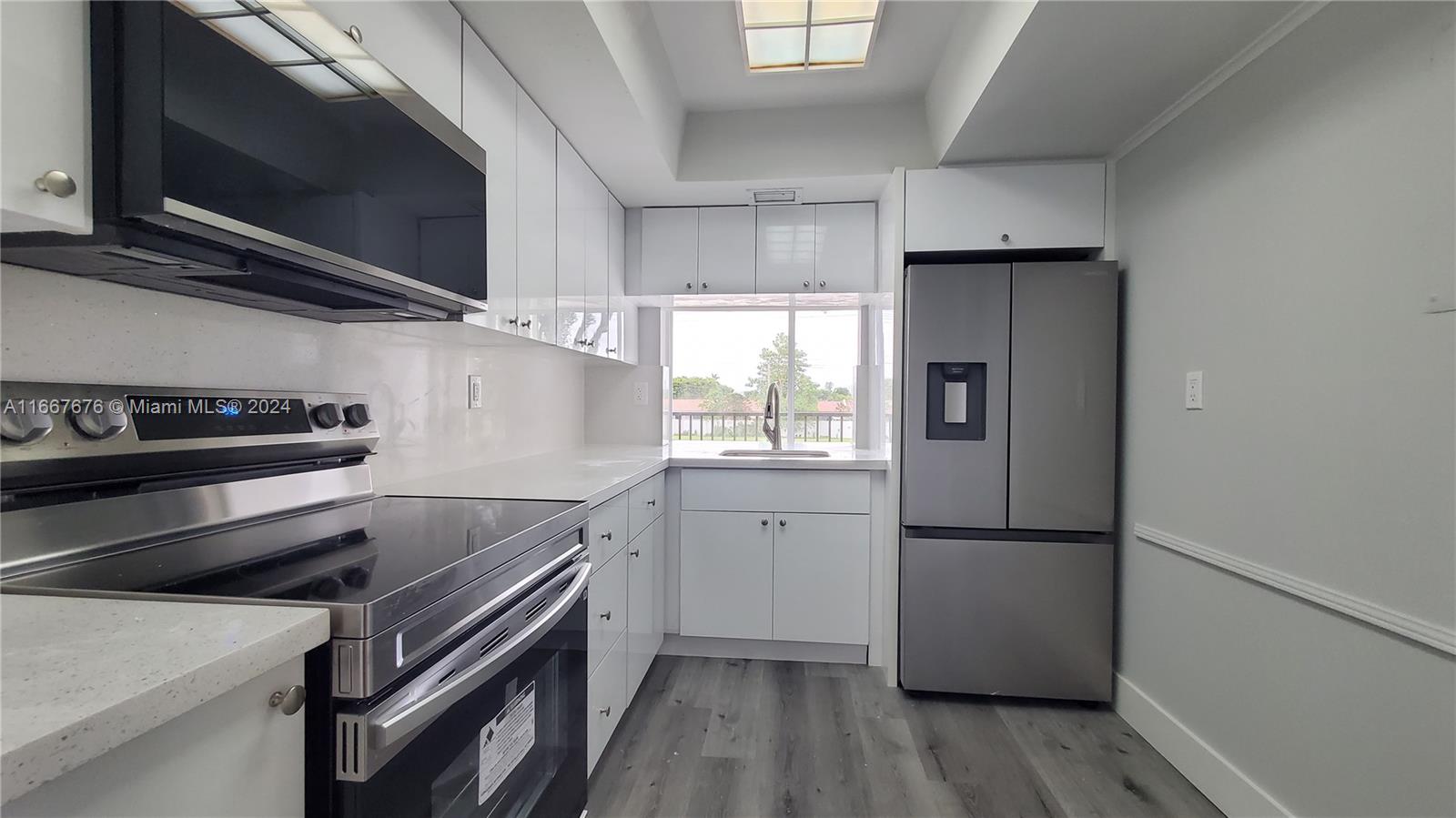 a kitchen with a stove and a refrigerator