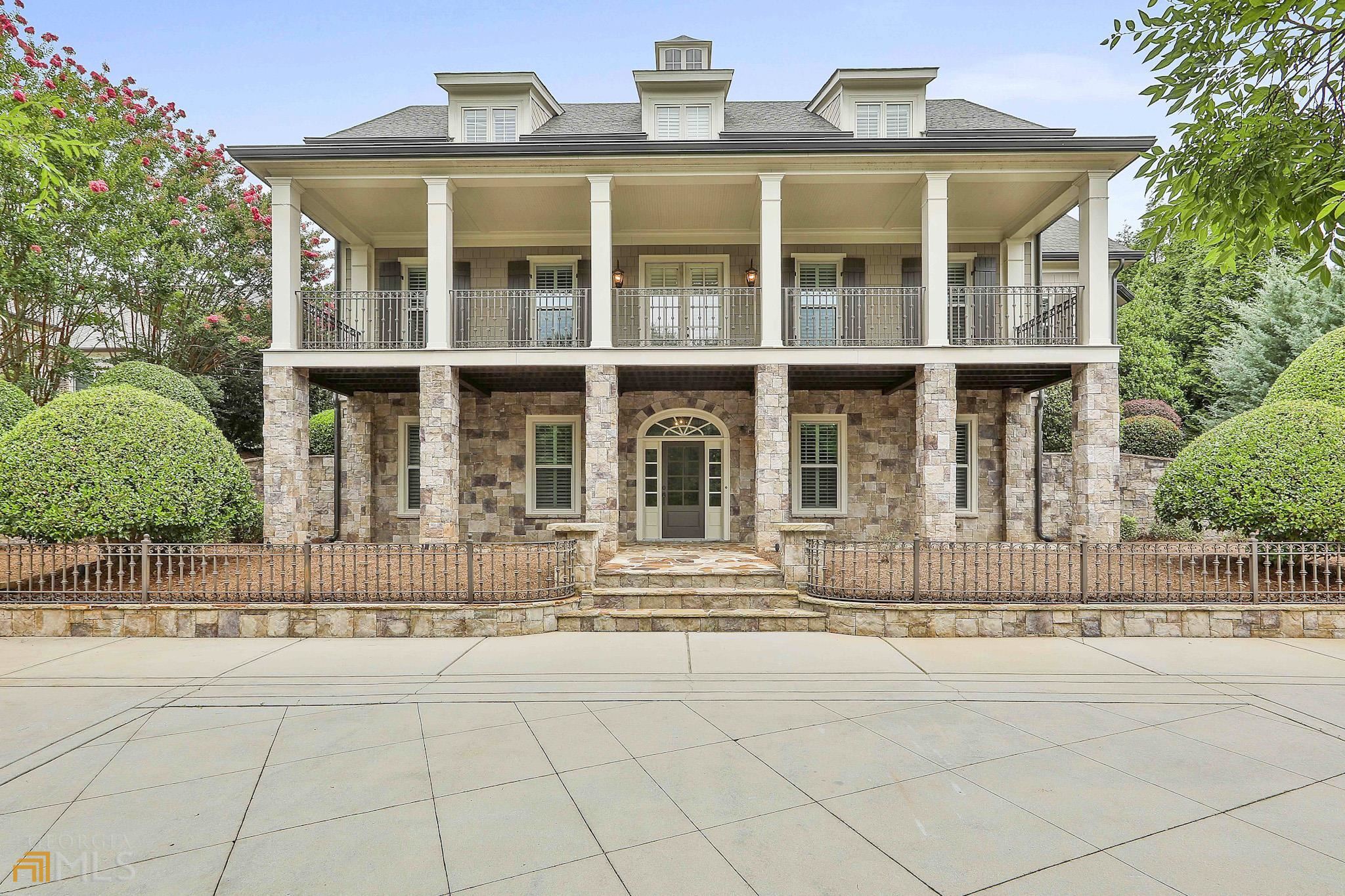 front view of a brick house with a large windows