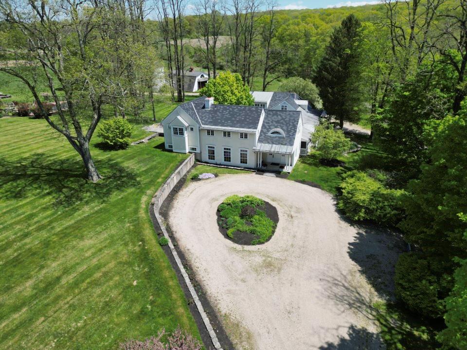 an aerial view of a house with outdoor space and street view