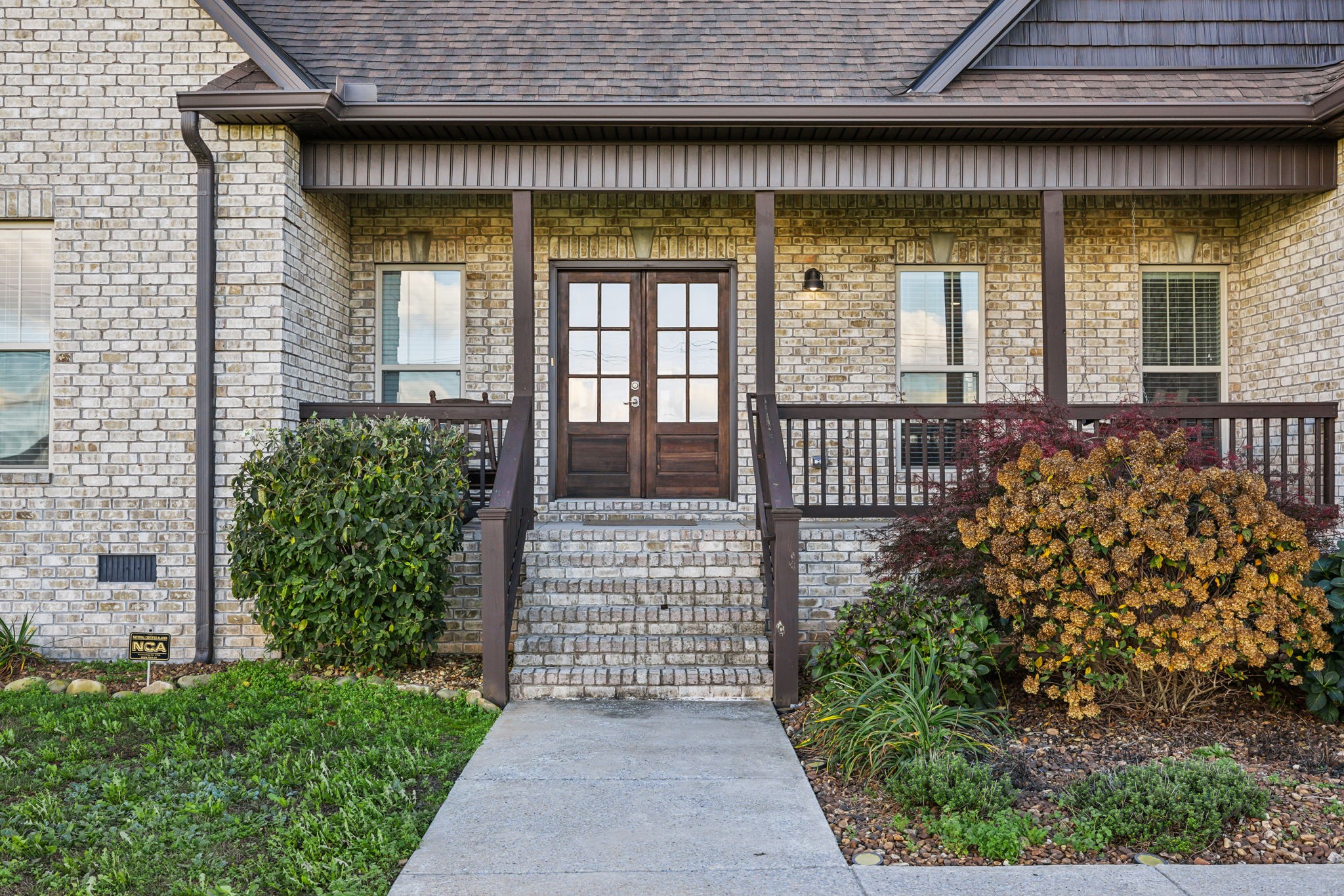 The covered front porch welcomes you to this amazing all brick home! Room for a swing for those warm summer days