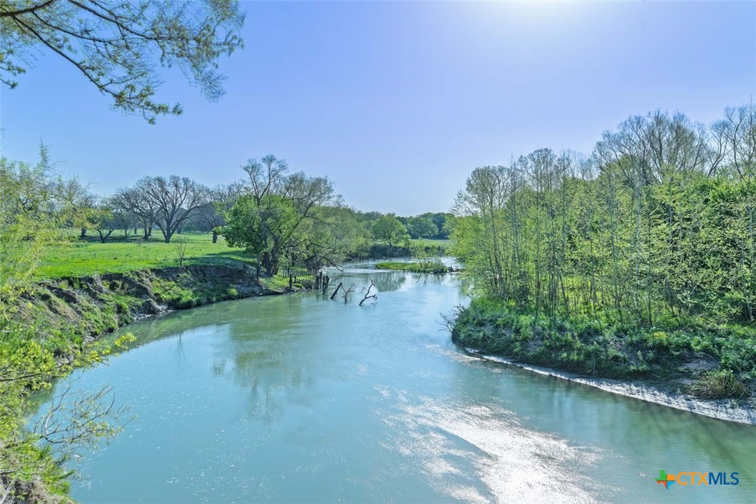 a view of a lake view with a garden