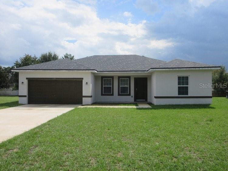 front view of a house with a garden