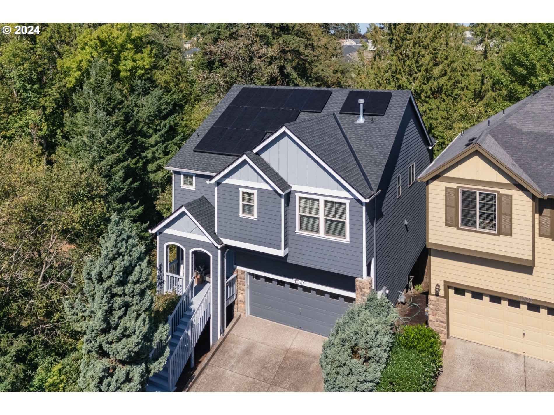 a aerial view of a house with a yard