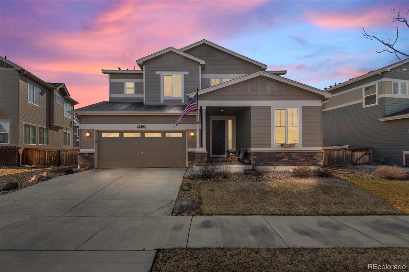 a front view of a house with garage