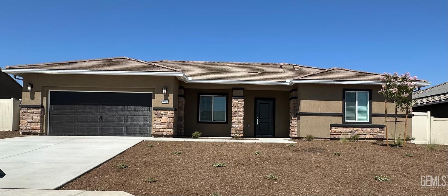 a front view of a house with a garage