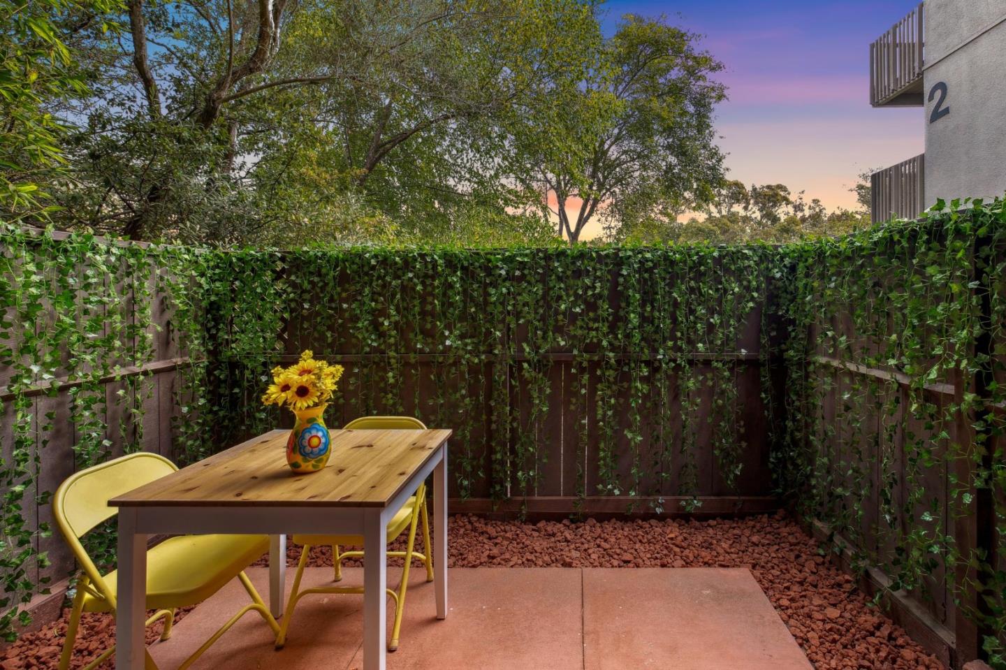 a view of a chairs and table in the patio