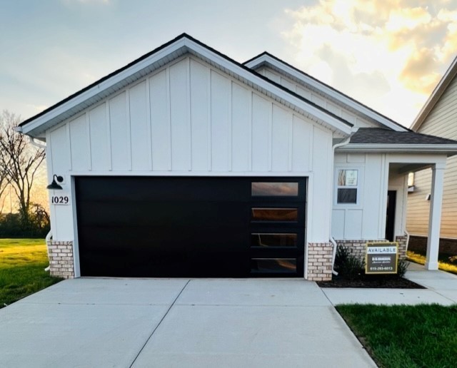 a backyard of a house with barbeque oven and seating space