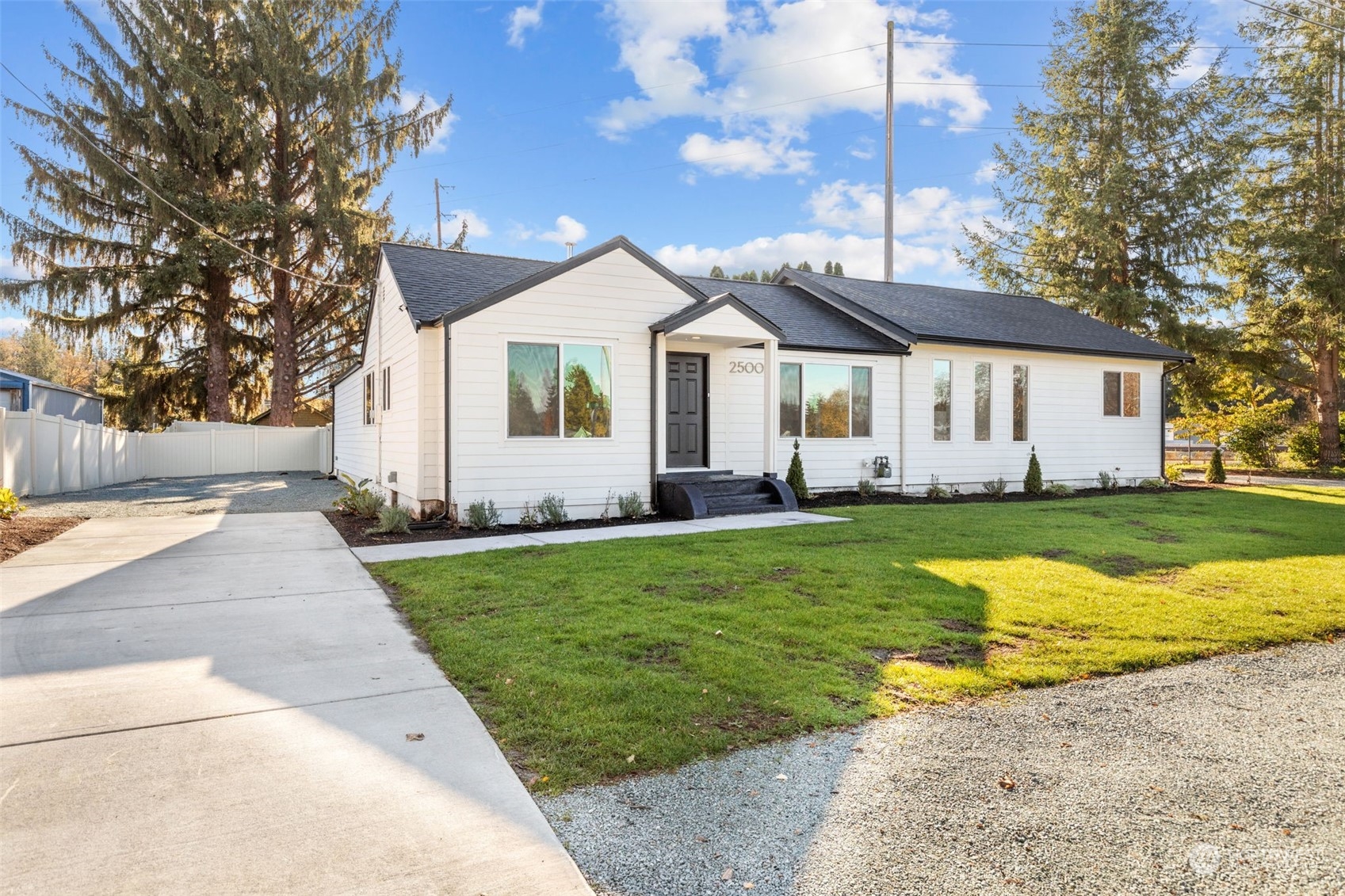 a front view of house with yard and green space