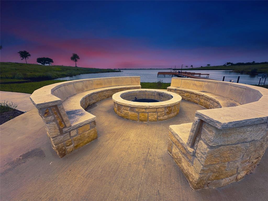 a view of a swimming pool with a chair and tables