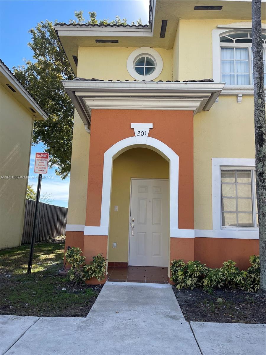 a front view of a house with yard