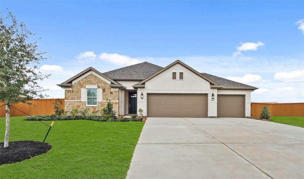 a front view of house with yard and green space