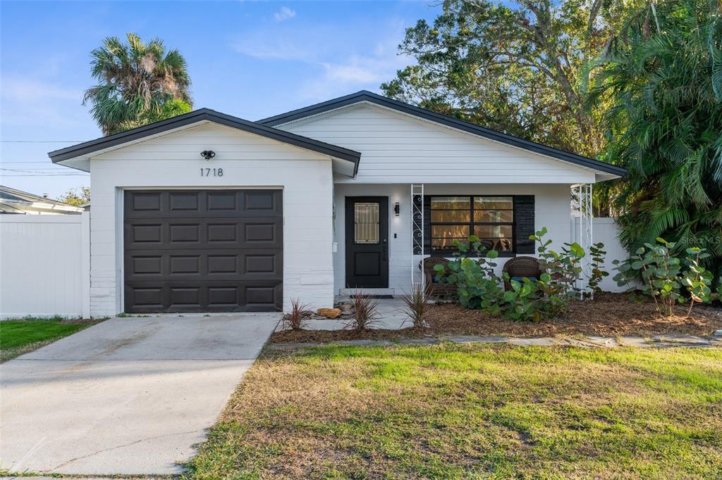 a front view of house with garage