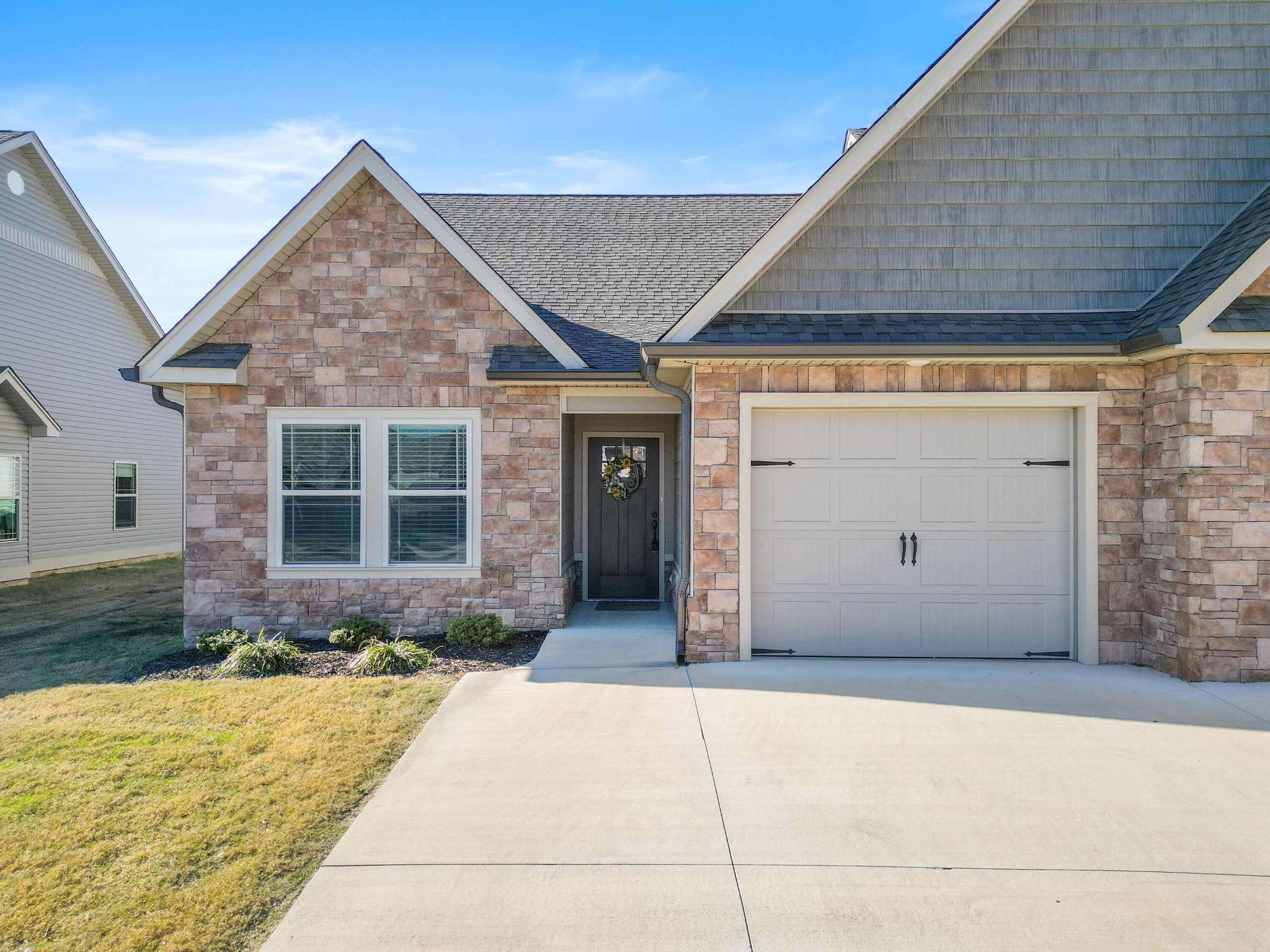 a front view of a house with a yard