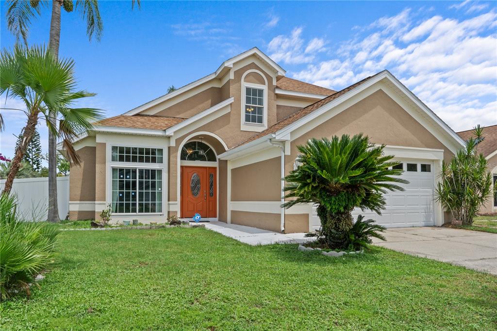 a front view of a house with a yard