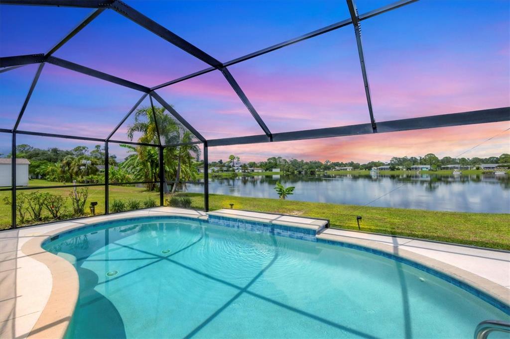 a view of swimming pool with a yard