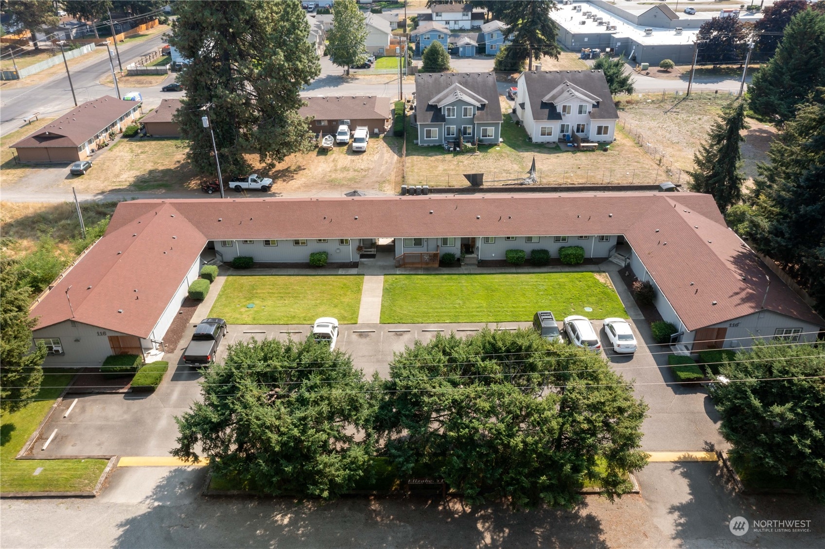 an aerial view of a house with a swimming pool yard and outdoor seating