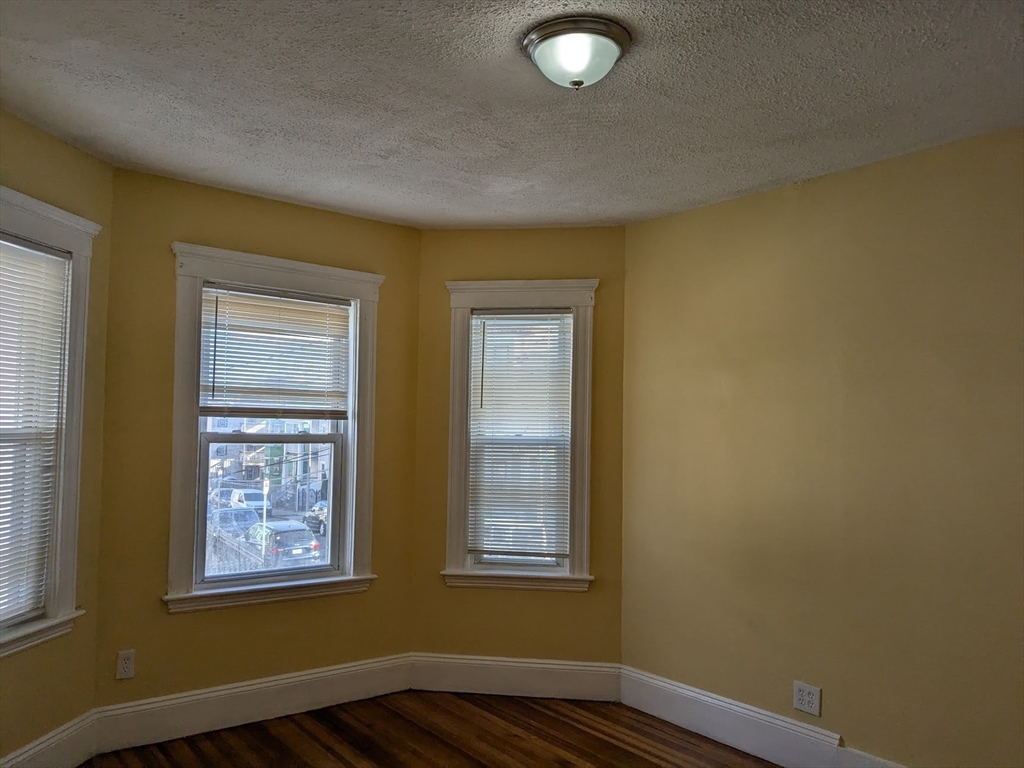 a view of an empty room with windows