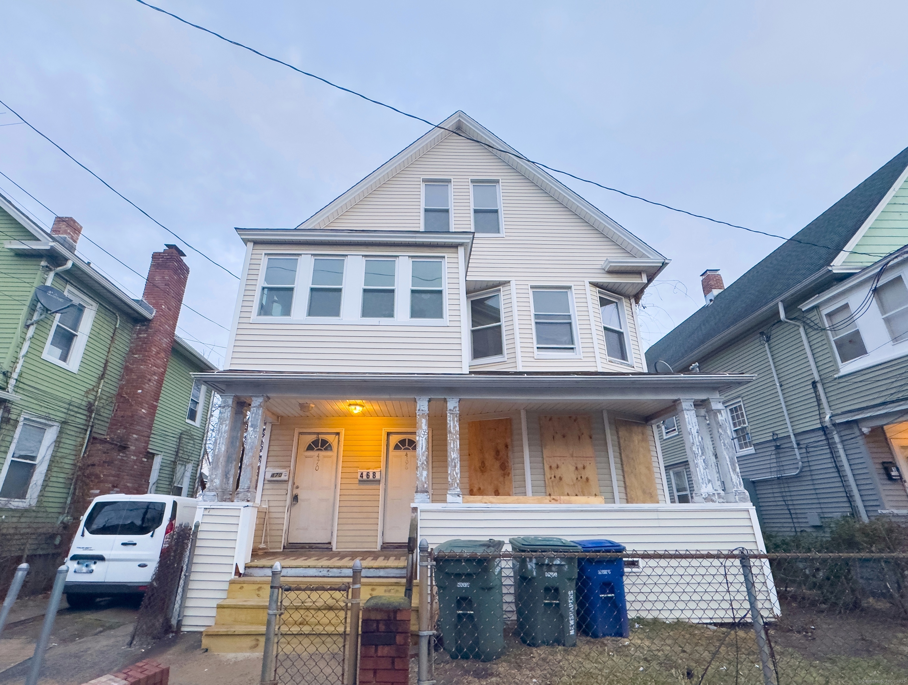 a front view of a residential apartment building with a yard